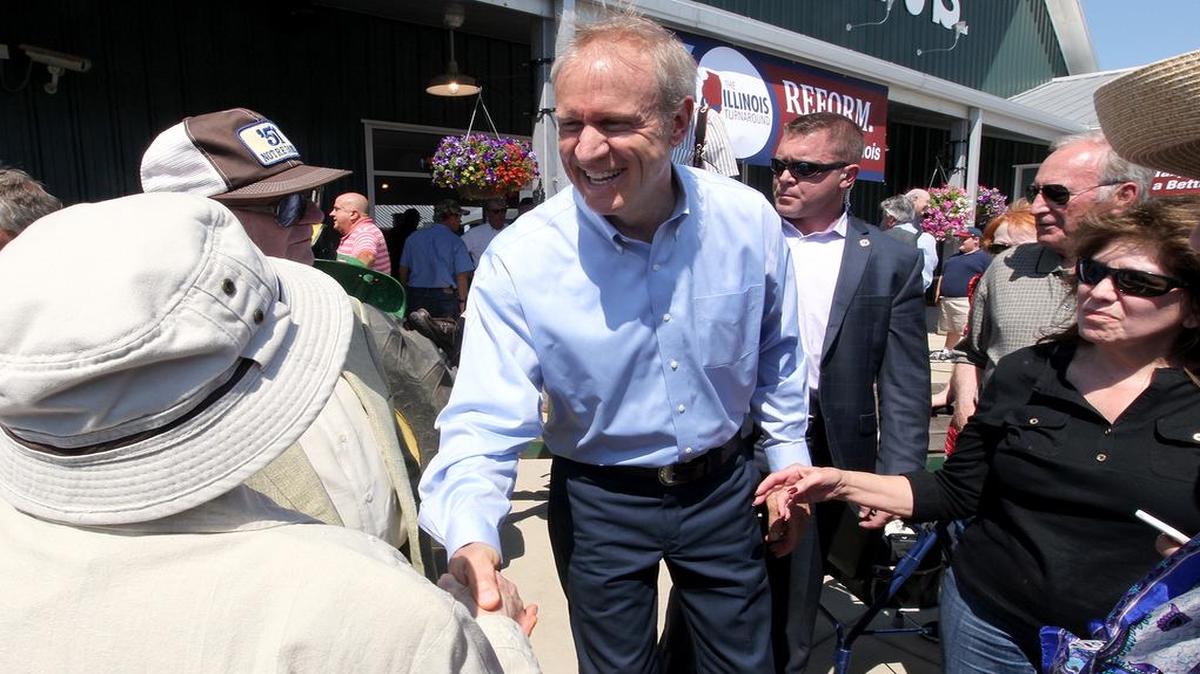 
Gov. Bruce Rauner mingles with the crowd after speaking at Eckert’s on Monday in Belleville. The governor’s speech was not well-received by all those in attendance.

