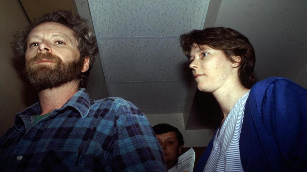 Robert and Paula Sims shortly after her arrest for the killings of their two infant daughters.