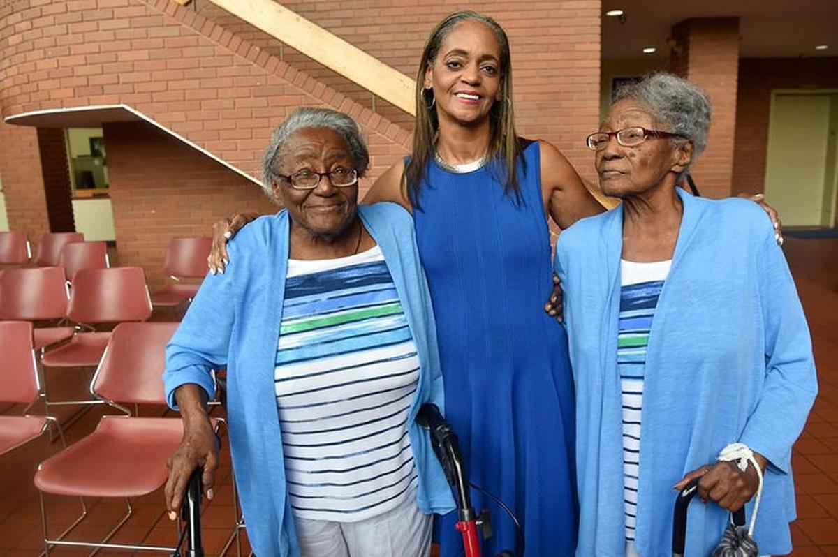 89-year-old Edna Mayes and Ethel Sylvester pose with East St. Louis Housing Authority’s Mildred Motley