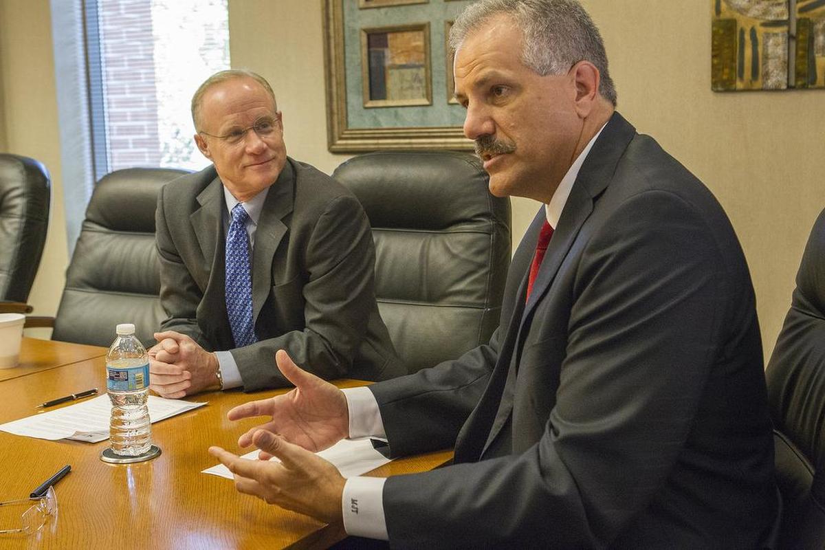 Former BJC HealthCare President and CEO Steven Lipstein, left, listens as Mark Turner, then president and CEO of Memorial Hospital, talks about their initial “strategic alliance” in this 2015 photo.