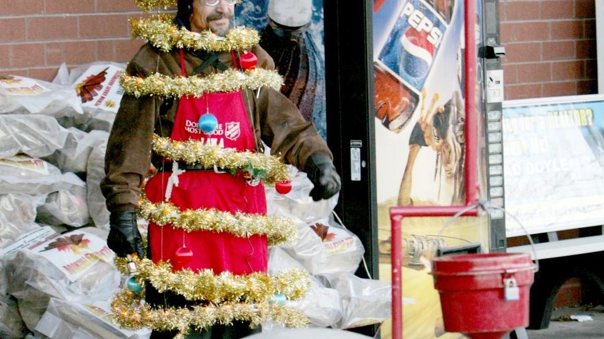 2007 photo of Mike Schissler of Belleville collecting donations for the Salvation Army dressed as a Christmas tree outside the Schnucks in Swansea. Schnucks said Tuesday that organizations and individuals will no longer be allowed to solicit donations outside its stores.