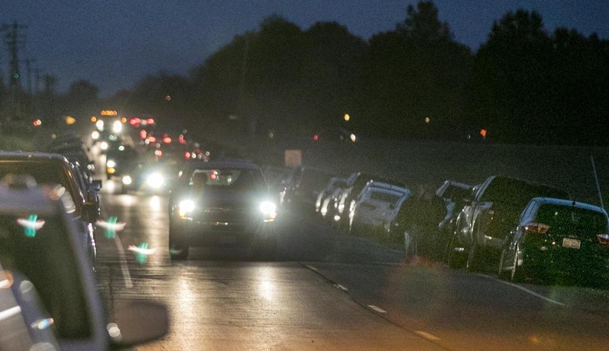 Cars are parked on the shoulder of Aviston road near the Aviston American Legion as people jockey for parking places for the "Queen of Hearts’ drawing at the Aviston American Legion. The drawing is getting a lot of interest as the prize approaches $1 million.