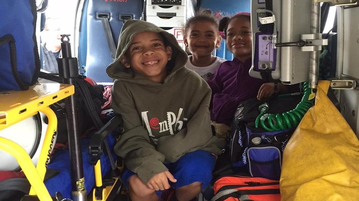 
Justine Riley, left, and his sister Piper Riley, center, and their cousin Alexis Simmons got to see the inside of a medical helicopter during the Community Safety Day on Saturday at Belleville’s Kmart.
