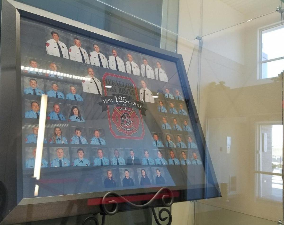 This framed collage of O’Fallon Fire Department staffers dedicates the 125th anniversary of the department, from 1891 to 2016.