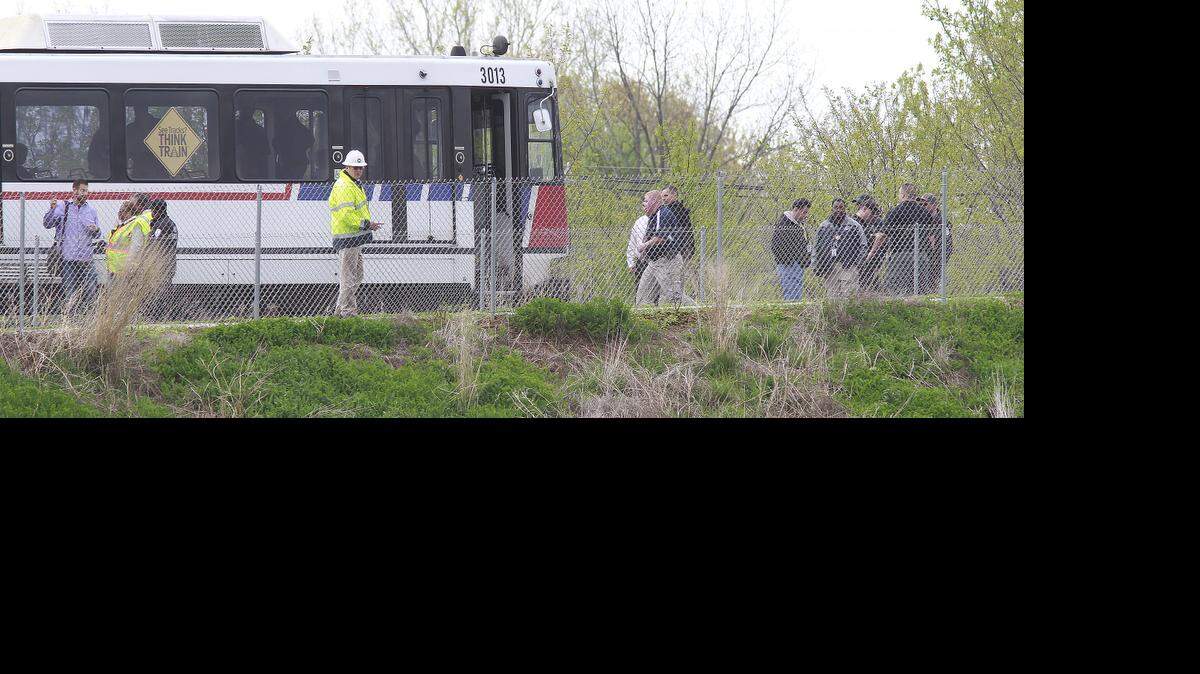 
Investigators and other first responders at the east end of the MetroLink train, which came to stop just west of the Illinois 159 overpass in Swansea. The train hit and killed a pedestrian on the tracks.
