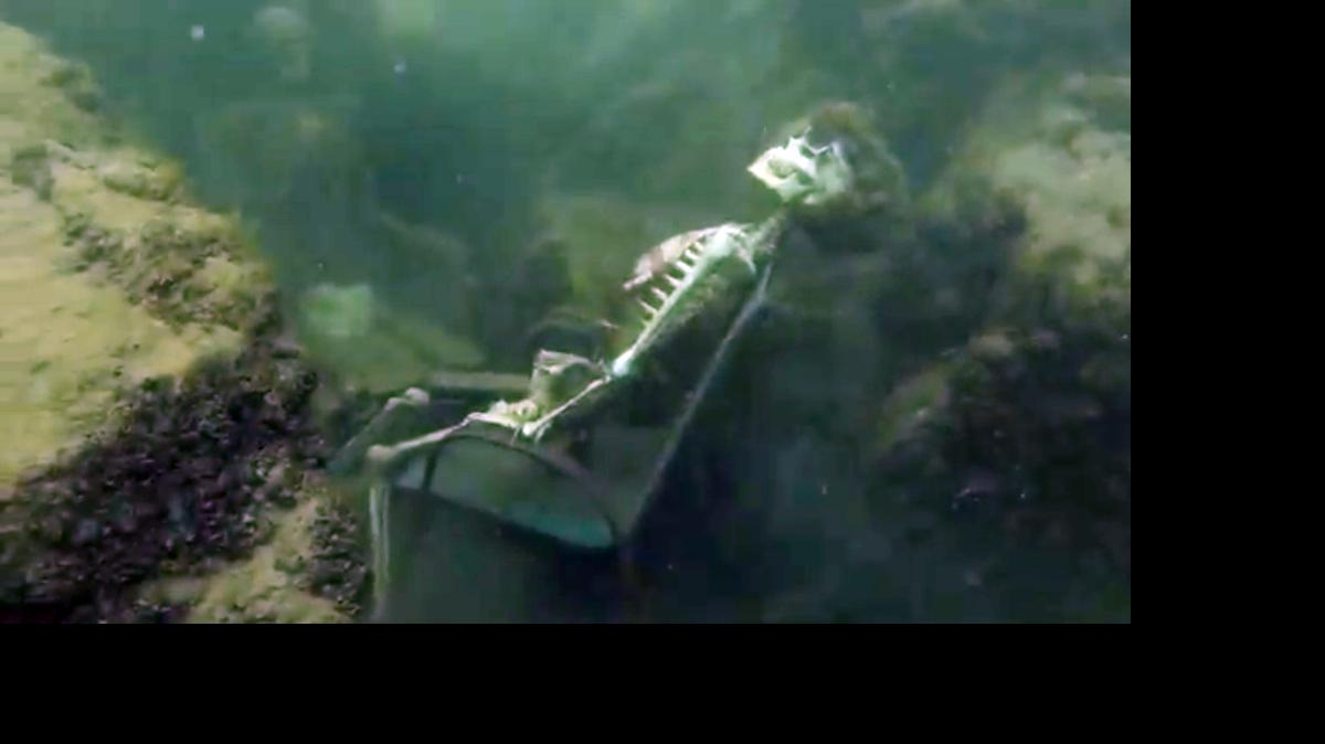 
In this frame from video provided by the La Paz Sheriffs’ Office, fake skeletons are strategically placed to appear as if they were sitting together with their lawn chairs bound to large rocks in the Colorado River near the Arizona and California border.
