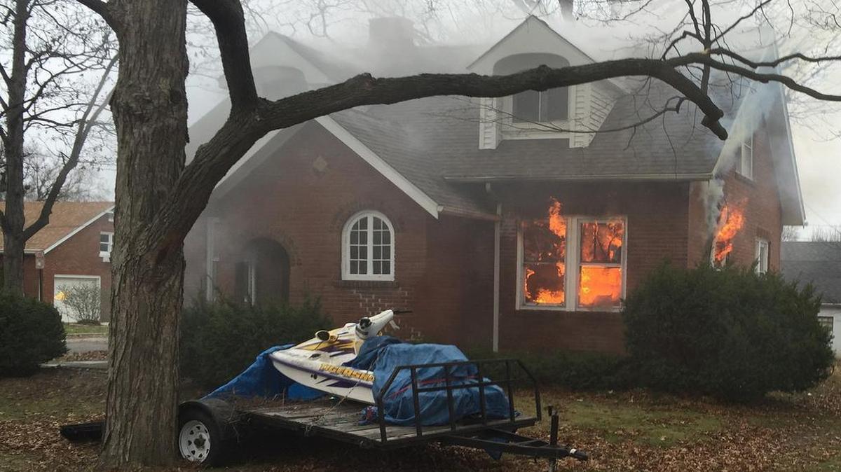 Fire burns in a home at 1901 Olive St. in Highland Tuesday morning.