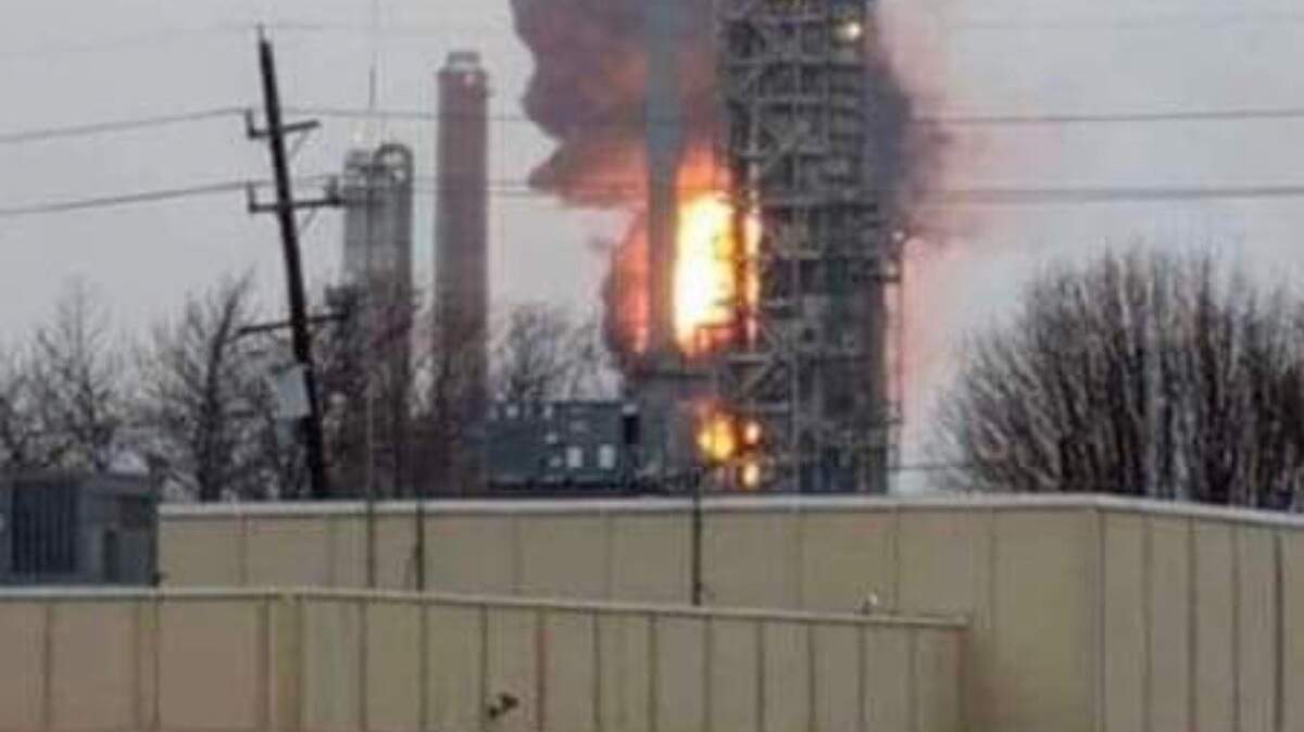 A fire burns Sunday afternoon at the Wood River refinery owned by Phillips 66.