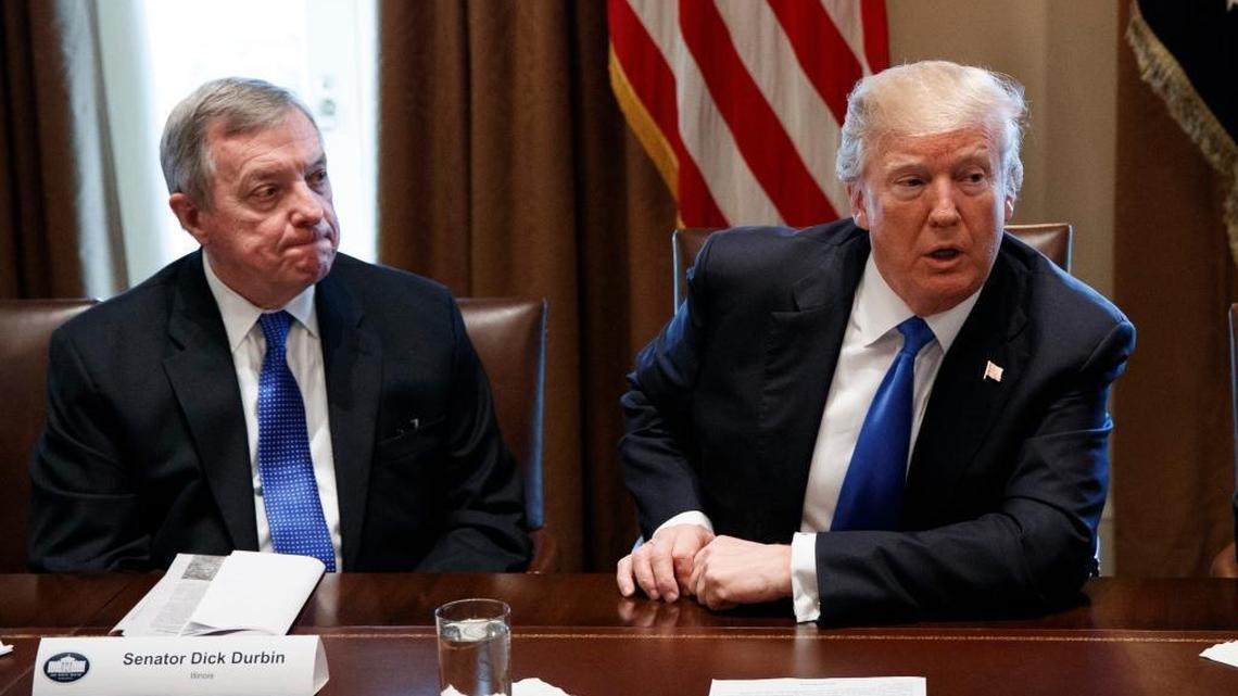 U.S. Sen. Dick Durbin, D-Ill., left, listens as President Donald Trump speaks during a meeting with lawmakers on immigration policy in the Cabinet Room of the White House in Washington.