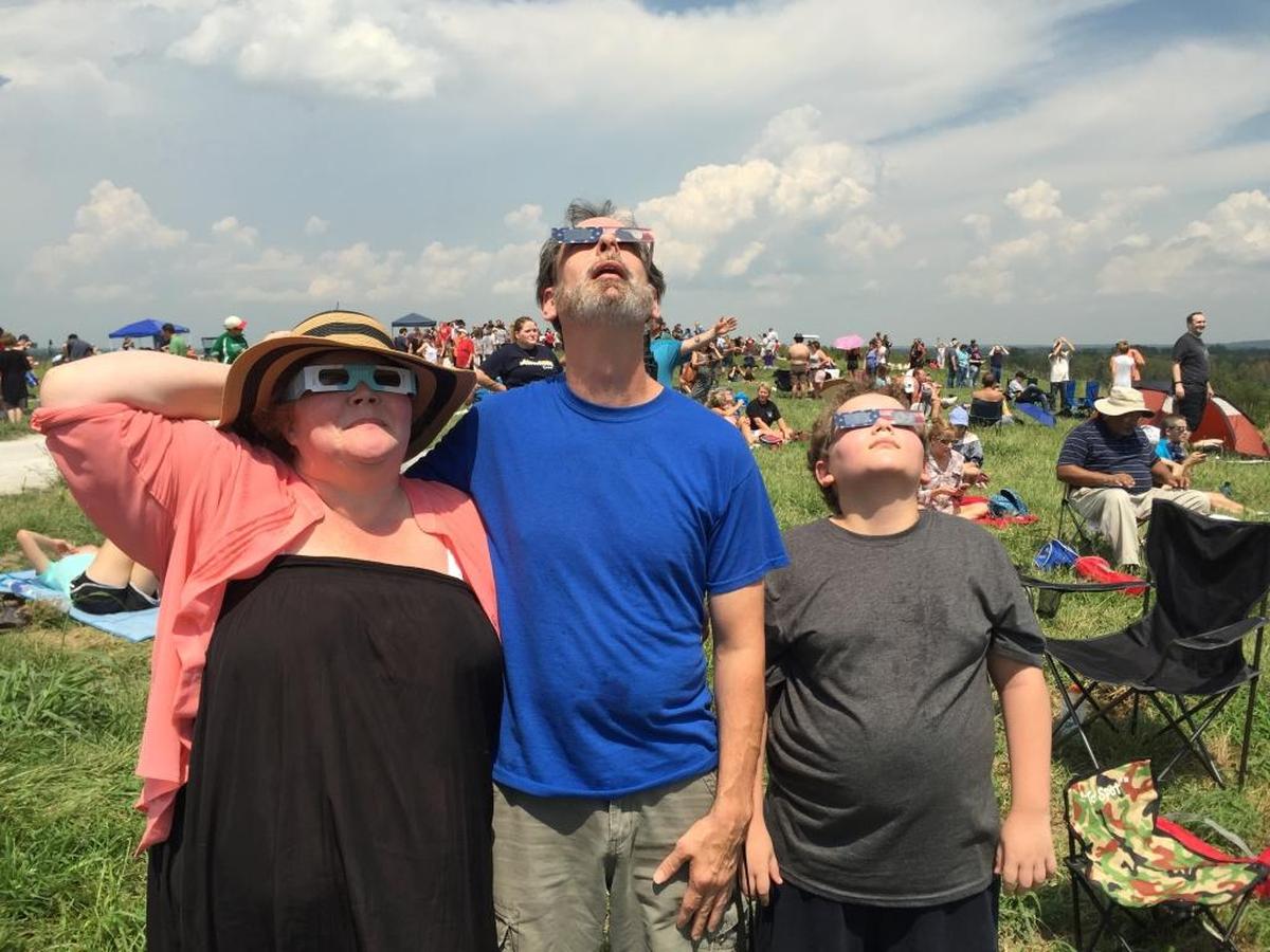 Julie and Keith Whittington drove two and a half hours from Peoria to Monks Mound at Collinsville with their 10-year-old son, Adian Arnold, to watch the solar eclipse. They came to the mound because of the land’s “spirituality.”