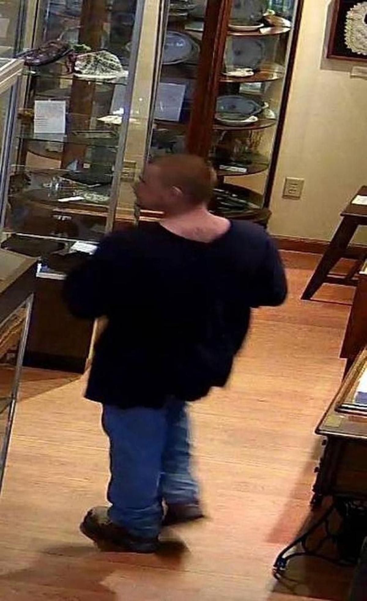 Surveillance video captured an image of a man apparently stealing the special edition copy of “Mein Kampf.”