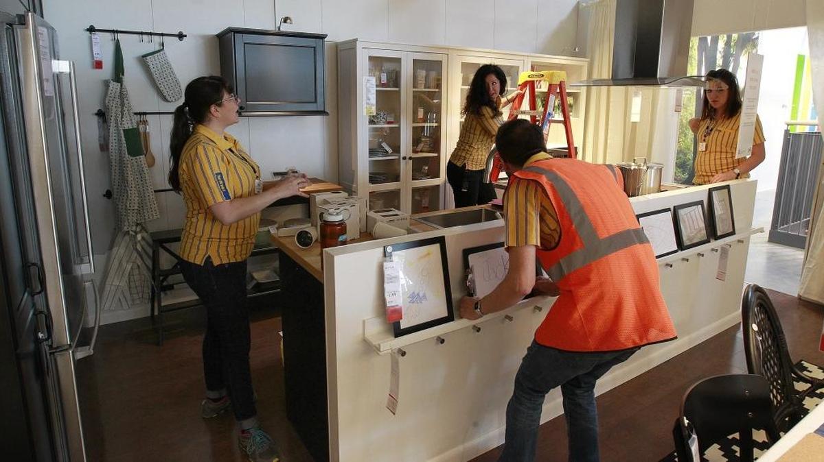 This September 23, 2015 file photo shows IKEA employees assembling a kitchen display at the 380,000 square foot store in St. Louis.