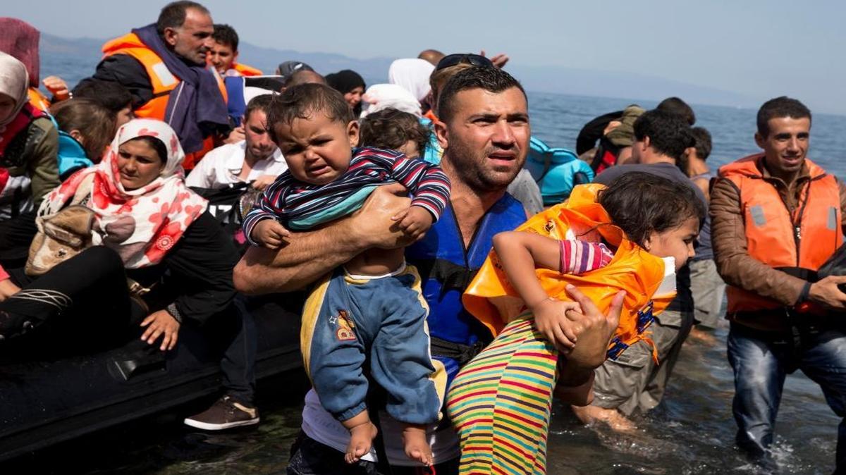 In this Sept. 10, 2015 file photo, Syrian refugees arrive aboard a dinghy after crossing from Turkey to the island of Lesbos, Greece. More than 76 years later, fresh angst about whether to admit refugees or turn them away has put the spotlight back on the 1939 shunning of the St. Louis, an ocean line carrying more than 900 Jewish refugees trying to escape Europe and other, now widely regretted, decisions by U.S. officials before and during World War II.