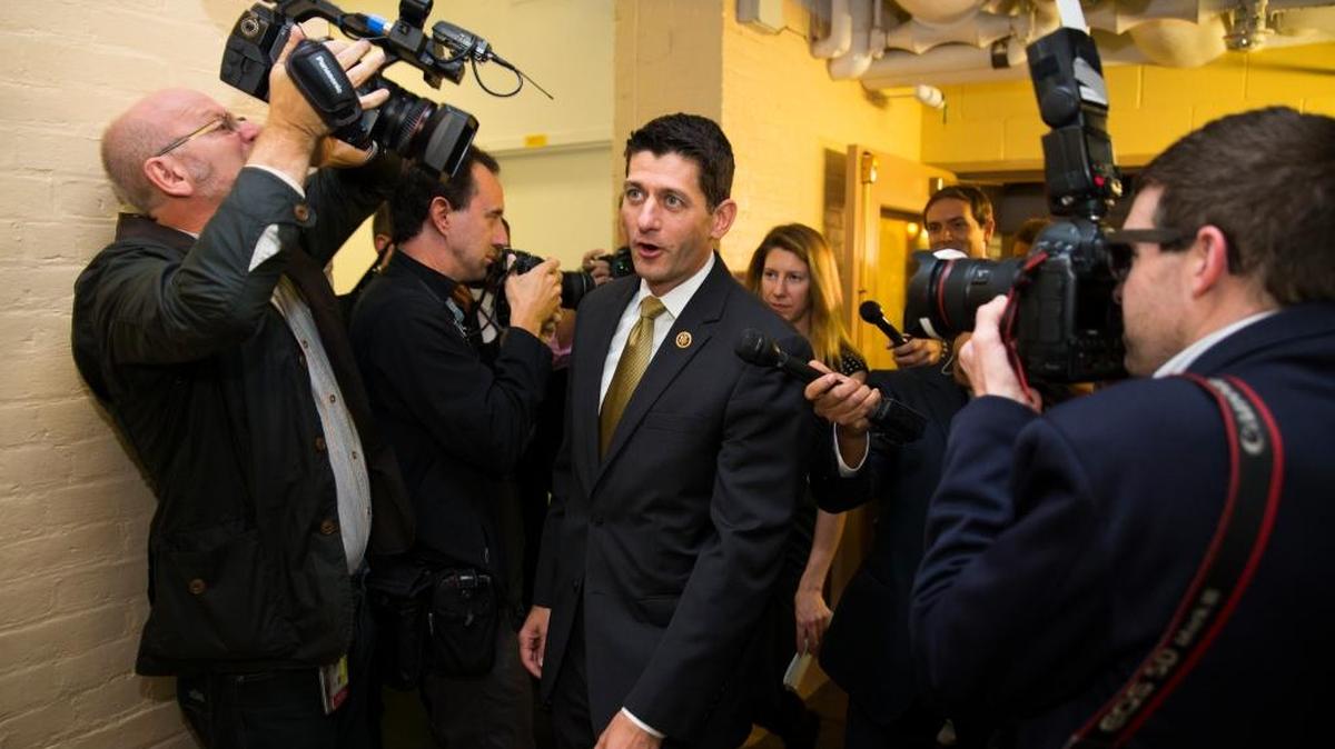 Rep. Paul Ryan, R-Wis., is surrounded by media as he arrives for a House GOP conference meeting in Capitol Hill in Washington, Wednesday, Oct. 21, 2015. Ryan is seeking unity in a place it's rarely found, telling House Republicans he will serve as their speaker only if they embrace him by week's end as their consensus candidate.