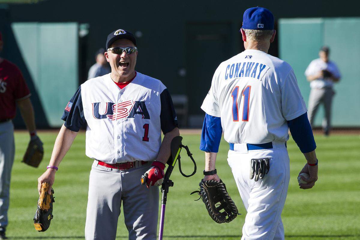 Majority Whip Steve Scalise, of Louisiana, left, talks with Rep. Mike Conaway, R-Texas, after warming up for the 57th Congressional Baseball Game at National’s Park in Washington, Thursday, June 14, 2018. On June 14, 2017, Scalise was shot at the baseball field he and some other members of Congress were practicing on in Alexandria, Va. (AP Photo/Cliff Owen)