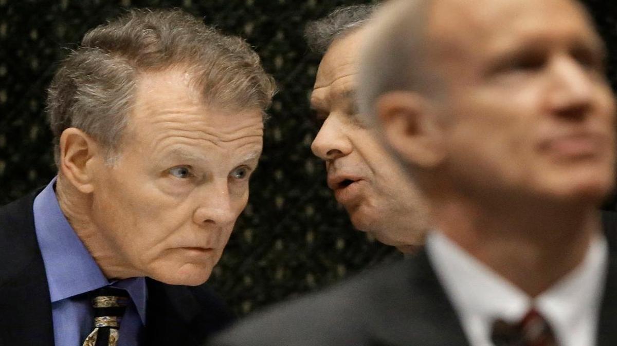 In this Feb. 17, 2016 photo, Illinois Speaker of the House Michael Madigan, D-Chicago, left, speaks to Illinois Senate President John Cullerton, D-Chicago, center, while Illinois Gov. Bruce Rauner, right, delivers the State of the Budget Address to a joint session of the General Assembly in the House chambers at the Illinois State Capitol in Springfield. The political rivalry between the Republican Rauner and the Democratic Madigan has intensified during Illinois’ 10-month budget stalemate, leaving little hope that the state will have a spending plan any time soon.