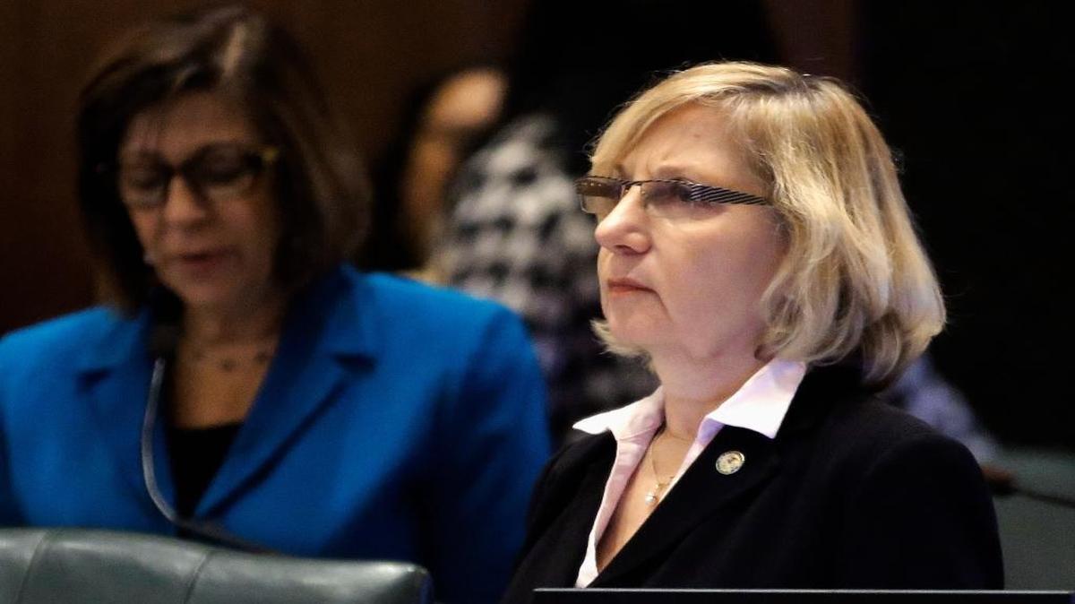 In this Dec. 3, 2014, file photo, Illinois state Rep. Robyn Gabel, D-Evanston, listens to debate legislation on the House floor at the Capitol in Springfield. Gabel is making her third attempt in a year to legalize certified professional midwives in Illinois, which has barred the practice since 1987. The proposal is staunchly opposed by some doctors, who say babies should be born only in hospitals.