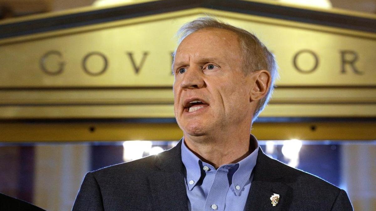 In this Thursday, June 30, 2016 photo, Illinois Gov. Bruce Rauner speaks to reporters in front of his office at the Illinois State Capitol in Springfield after lawmakers passed a stopgap budget. Illinois has redefined what it means to have a late budget. Other states have gone several months without a spending plan before and Illinois has had previous delays that caused great anxiety. But no state has gone as long as Illinois without a budget in modern history.