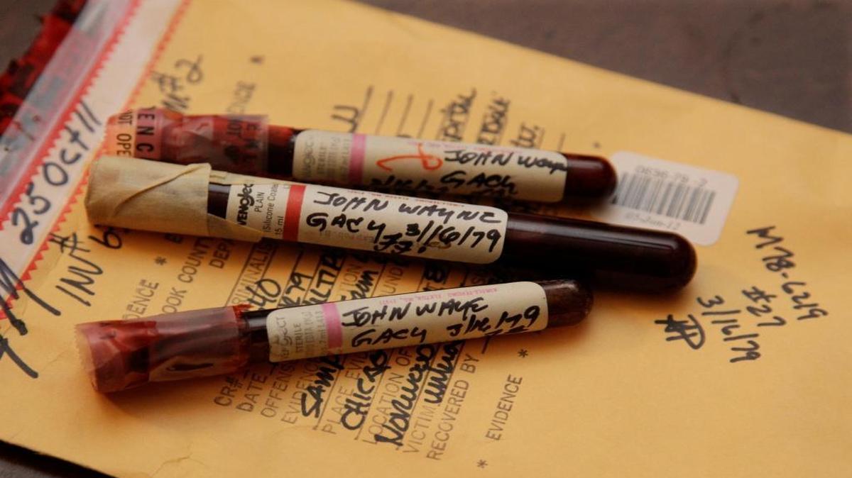 This Nov. 30, 2012, file photo, taken in Chicago shows three vials of serial killer John Wayne Gacy’s blood discovered by Cook County Sheriff’s Detective Jason Moran. The sheriff’s office has been working for years to discover the names of Gacy’s unidentified victims and a Texas lab created DNA profiles to help in the process. So far, one of eight has been identified. As part of the investigation, Moran has cleared 11 other cold cases across America that had nothing to do with Gacy.