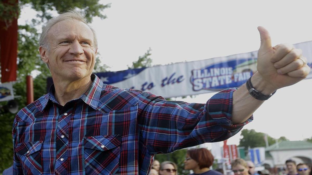
Illinois Gov. Bruce Rauner greets fairgoers Aug. 13 at the Illinois State Fair, in Springfield. Illinois, already cash-strapped, is on course to dig itself a far greater budget hole, through either unwillingness or inability by lawmakers to act on the current fiscal year’s budget. One estimate puts the deficit at $5 billion, thanks to court- and statute-mandated spending at levels that both sides say is unsustainable
