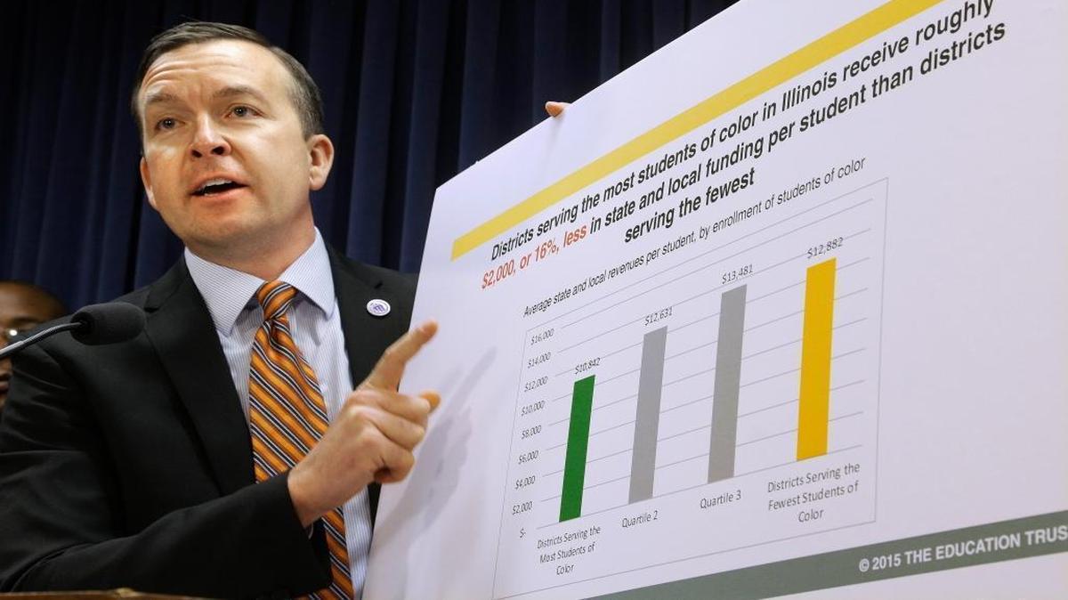 In this Jan. 20, 2016, photo, Illinois state Sen. Andy Manar, D-Bunker Hill, speaks to reporters at a news conference on education funding at the state Capitol in Springfield. Manar has proposed a bill that would create a need-based formula that gives schools in property poor areas more money per student and increase funding for schools with higher than average special education students.