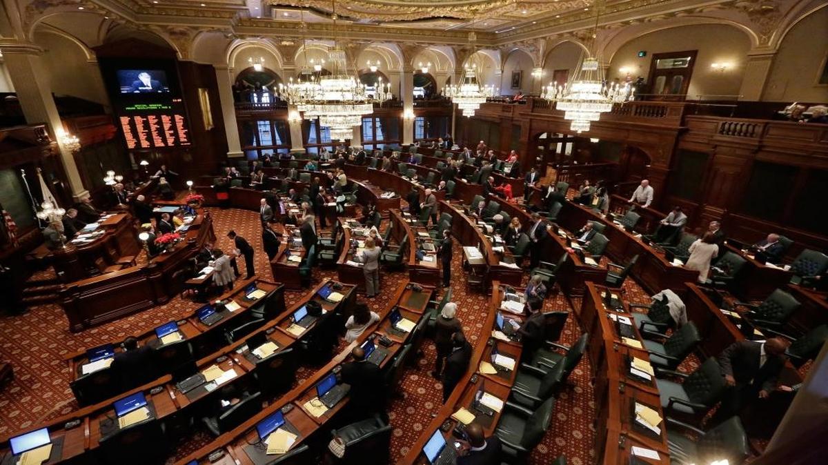 In this Jan. 9, 2015, file photo, Illinois lawmakers listen to Illinois Speaker of the House Michael Madigan, D-Chicago, left, in Springfield.