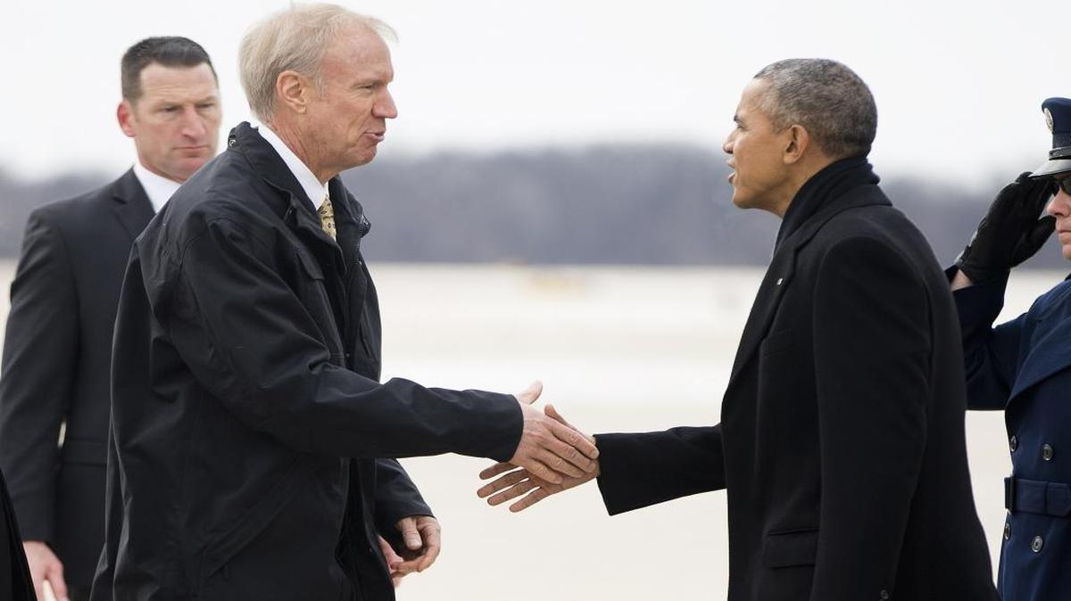 In this Feb. 10, 2016, file photo, President Barack Obama is greeted by Illinois Gov. Bruce Rauner during his arrival on Air Force One in Springfield, Ill. An effort to change the way political maps are drawn is shaping up as one of the biggest battles of 2016 in Illinois. Obama criticized the process during a speech in Springfield last week, saying it too often favors one political party.