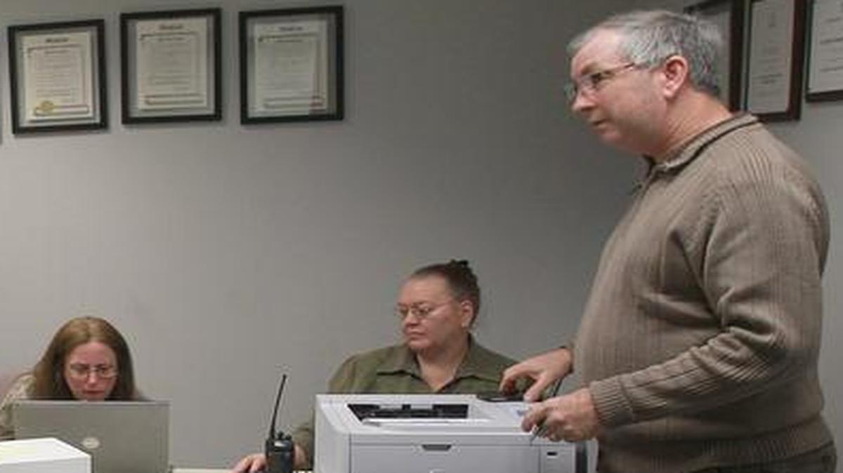 Former St. Clair County Clerk Bob Delaney in April 2013 presides over a vote count for absentee and provisional ballots. He accepted $3,000 in campaign contributions from the company awarded an $826,560 no-bid contract for election services.