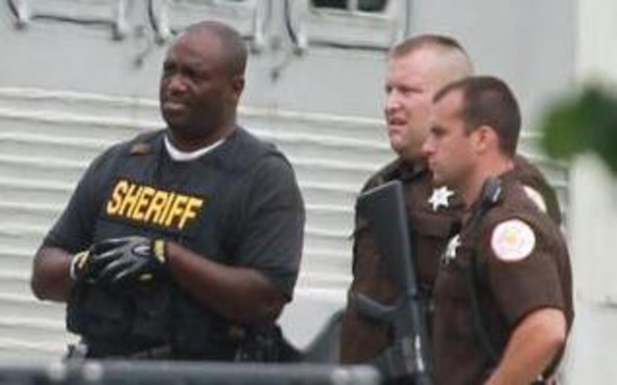 St. Clair County Sheriffs deputies in 2013 work a hostage crisis. Last year patrol deputies earned $296,845 in overtime pay. Would it be better to hire a few more deputies?