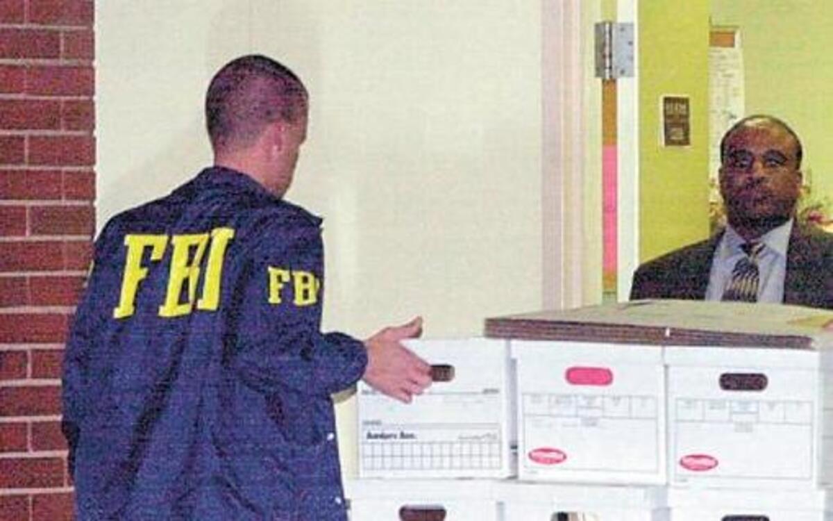 Federal agents during one of the raids investigating vote fraud in East St. Louis.