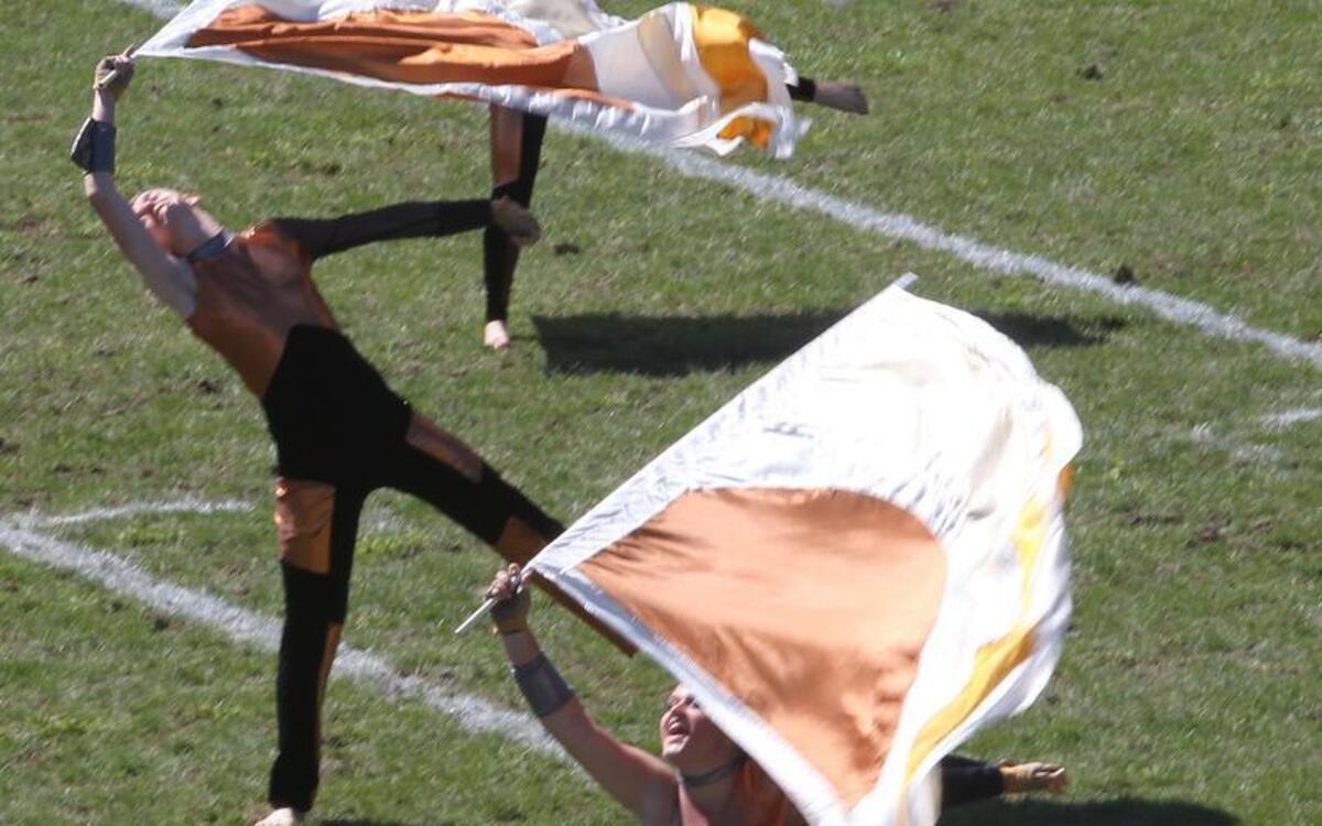 Tiger orange has been the color for supporters of the 55-cent property tax hike referendum in Edwardsville. Here, the Edwardsville High School Marching Tigers perform during a competition in 2013. Future cuts are expected if the tax increase fails.