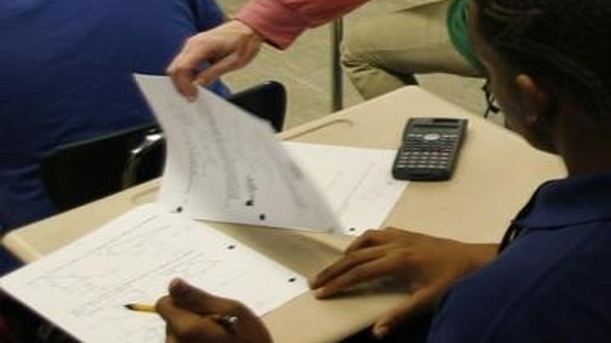 In 2007, Belleville East teacher Natalie Peters worked with students on a geometry word problem packet in preparation for the PSAE and ACT tests. Both tests are now buried in Illinois’ standardized testing graveyard.