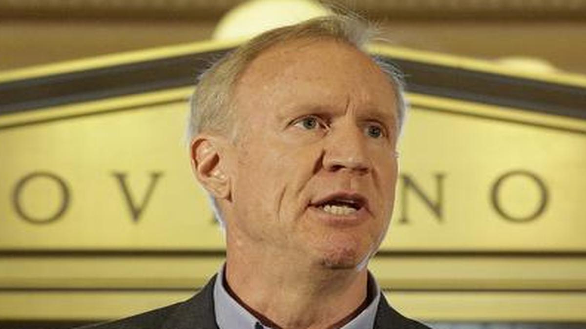 Illinois Gov. Bruce Rauner speaks to reporters June 30. His order to control an anticipated $15 million overtime bill for home care workers created a union backlash. The workers care for severely disabled adults in their homes.