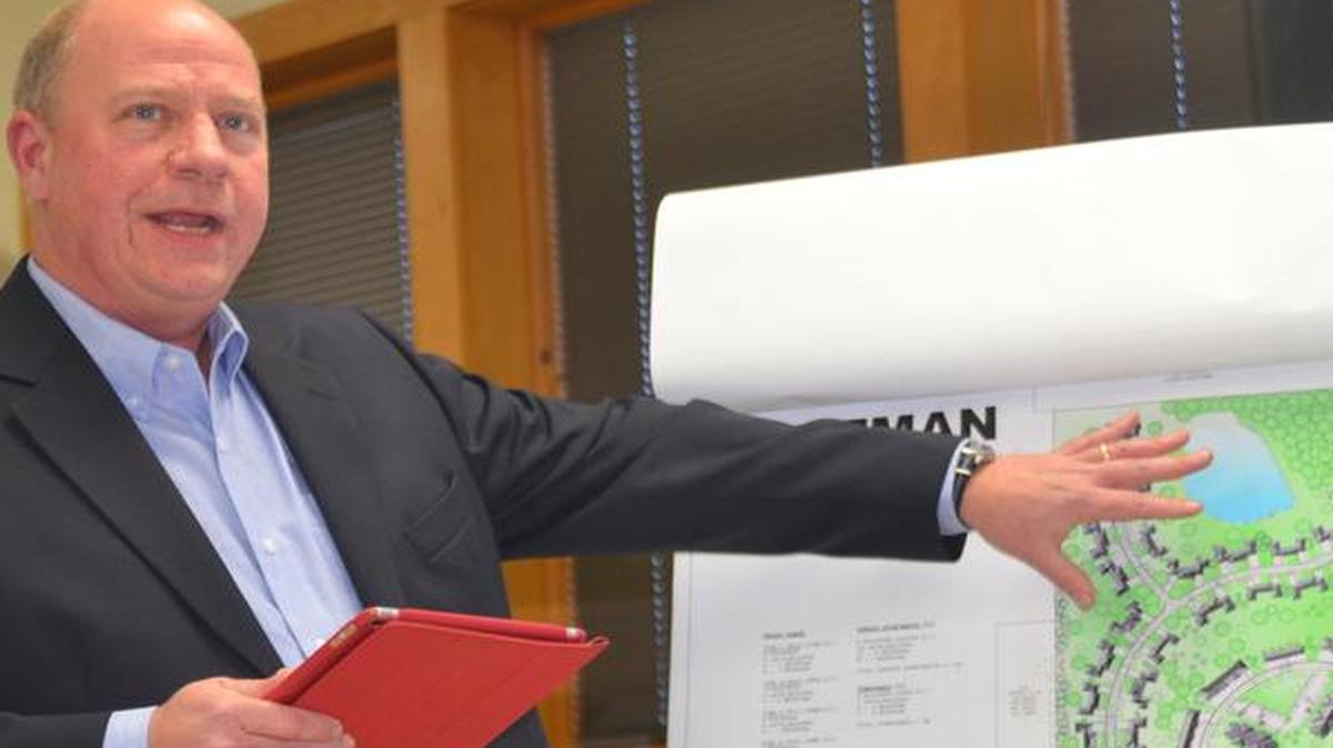 Eric Olson, of Millennia Professional Services of Illinois Ltd., presents diagrams of the proposed Hartman Lakes development to the Shiloh Board of Trustees last week.