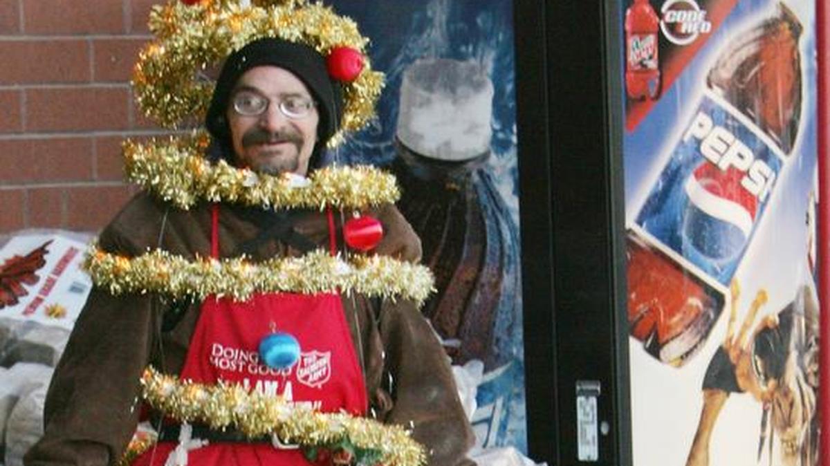Mike Schissler of Belleville in 2007 collected donations for the Salvation Army dressed as a Christmas tree outside the Schnucks in Swansea. Schnucks is ending solicitation at its stores, which last year raised $478,000 for the Salvation Army.