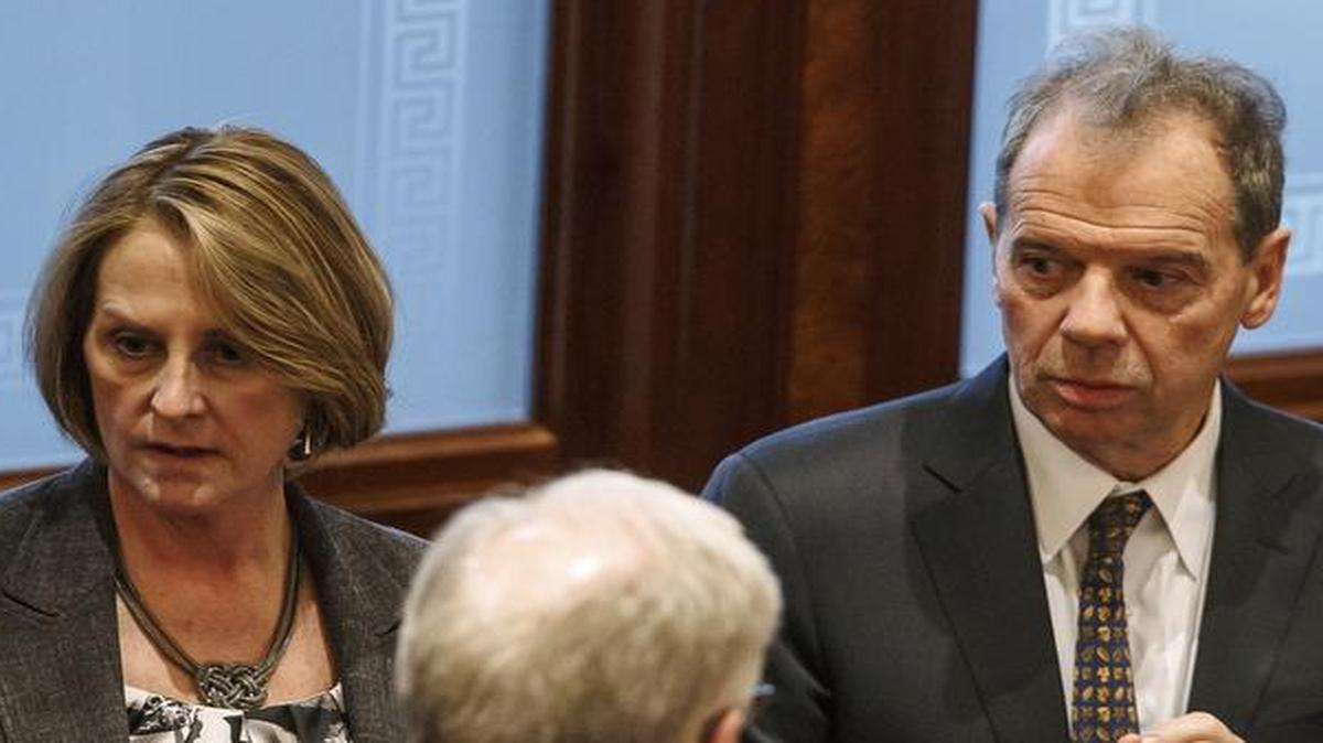 Illinois Senate Minority Leader Christine Radogno, R-Lemont, left, talks with Illinois Senate President John Cullerton, D-Chicago, right, at the Illinois State Capitol. A budget deal may come Wednesday, but at what cost to taxpayers?