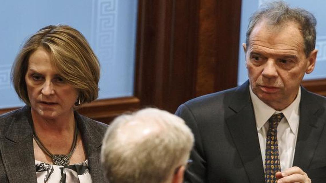 Illinois Senate Minority Leader Christine Radogno, R-Lemont, left, talks last week with Illinois Senate President John Cullerton, D-Chicago, right, at the Illinois State Capitol. The two are making compromises on reforms and a budget.
