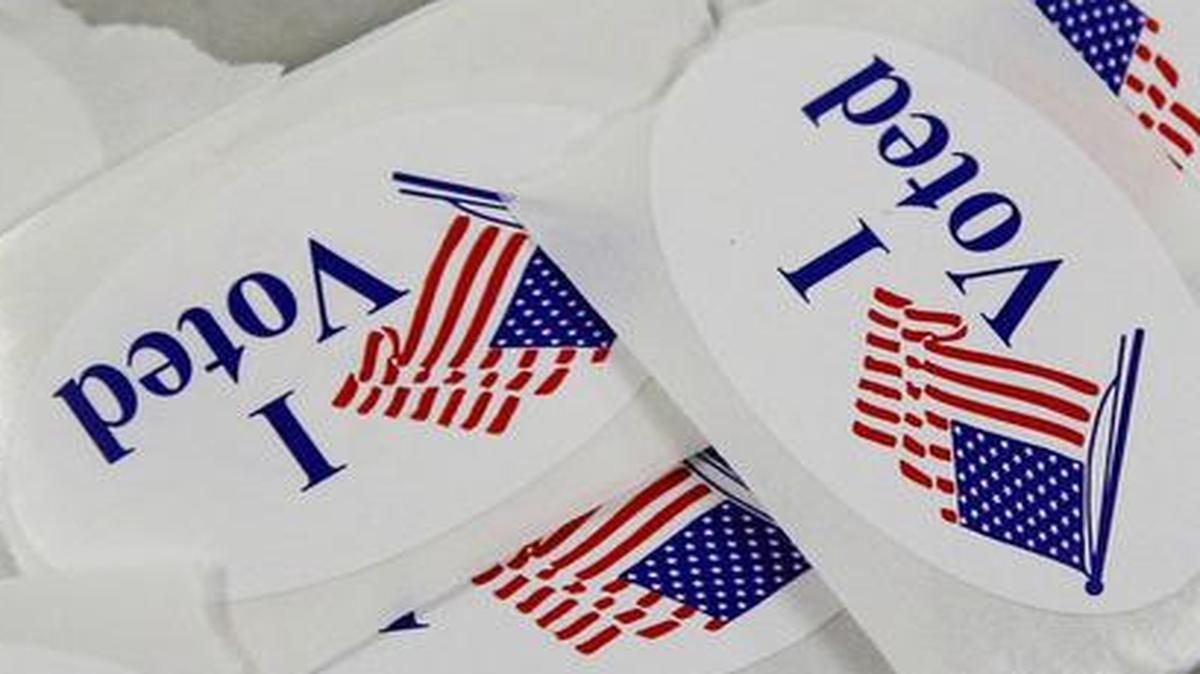 Voting stickers can be a badge of honor, or a sign that a vote was sold.
