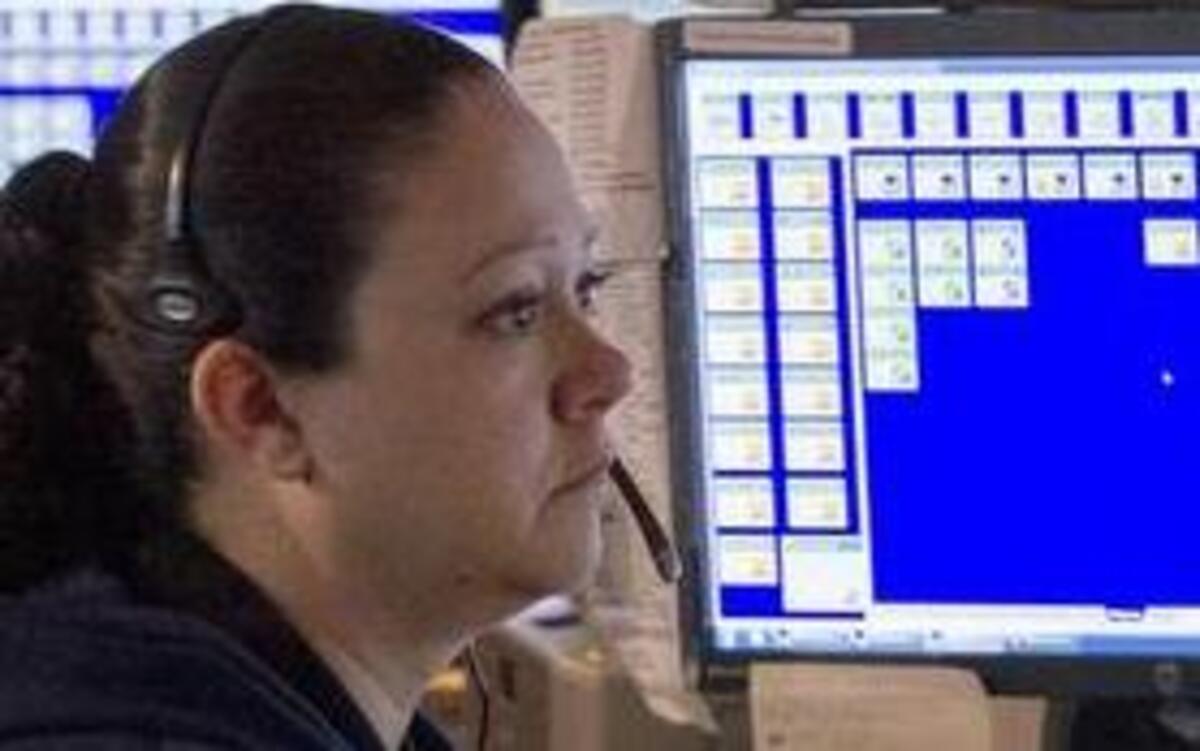 St. Clair County CENCOM, telecommunicators Linda Glasco, Sharon Davis and Shaun Kilman work the 9-1-1 call center in Belleville. Under a new state mandate, counties with at least 250,000 need to reduce the number of call centers by half.