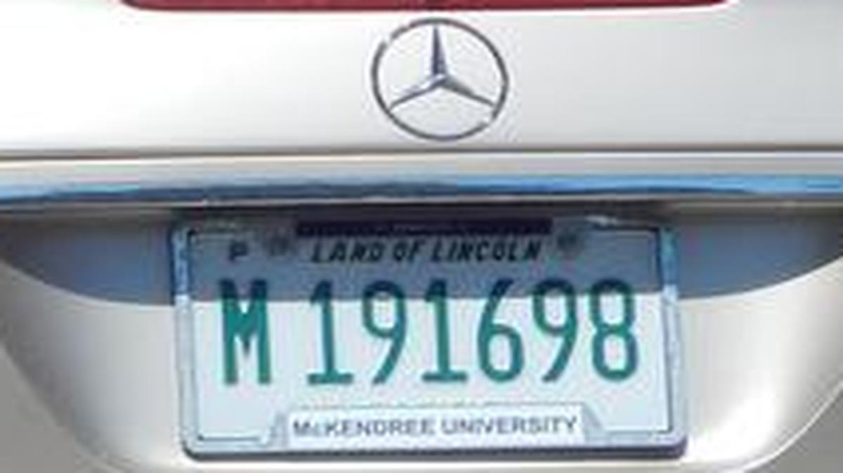 A 2003 Mercedes assigned to McKendree University President James Dennis has municipal license plates.