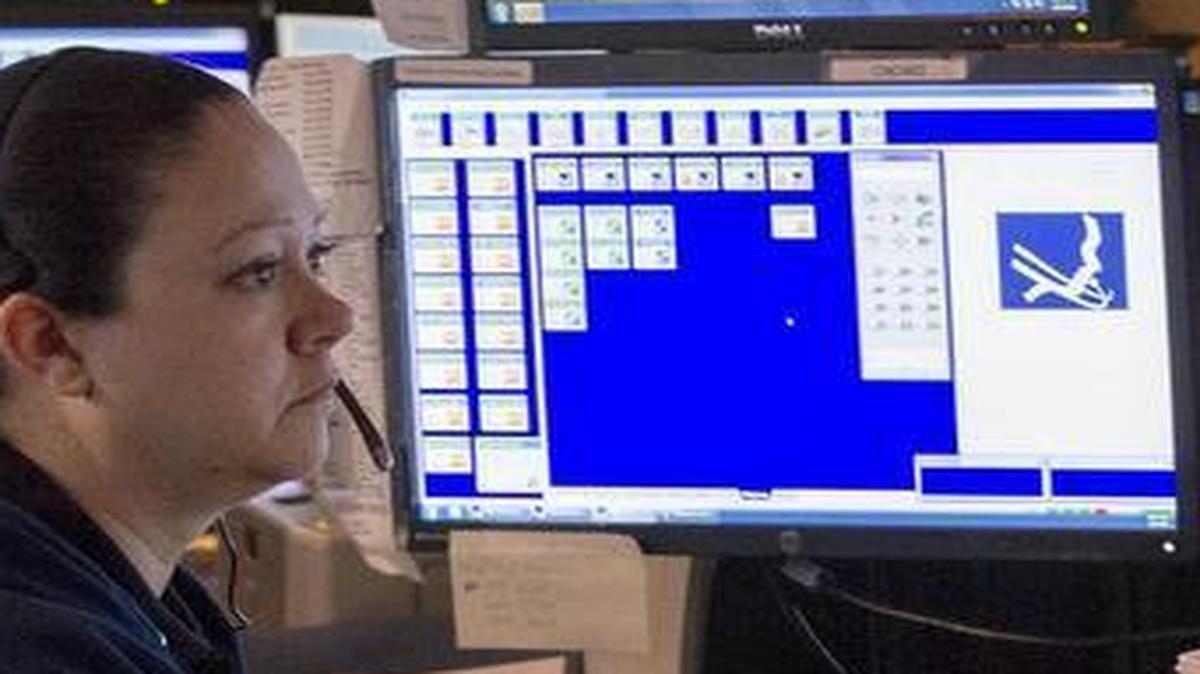 St. Clair County CENCOM telecommunicators Linda Glasco, Sharon Davis and Shaun Kilman work the 9-1-1 call center in Belleville. Under a new state mandate, counties with at least 250,000 need to reduce the number of answering points by half by July 1, 2017.