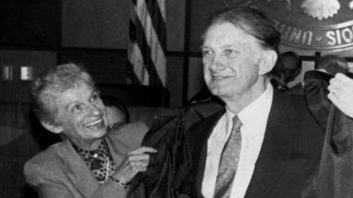 U.S. District Judge James Foreman watches on Aug. 29, 1986, as Celeste and Mary Stiehl help new federal judge William D. Stiehl put on his robes as he is sworn in.