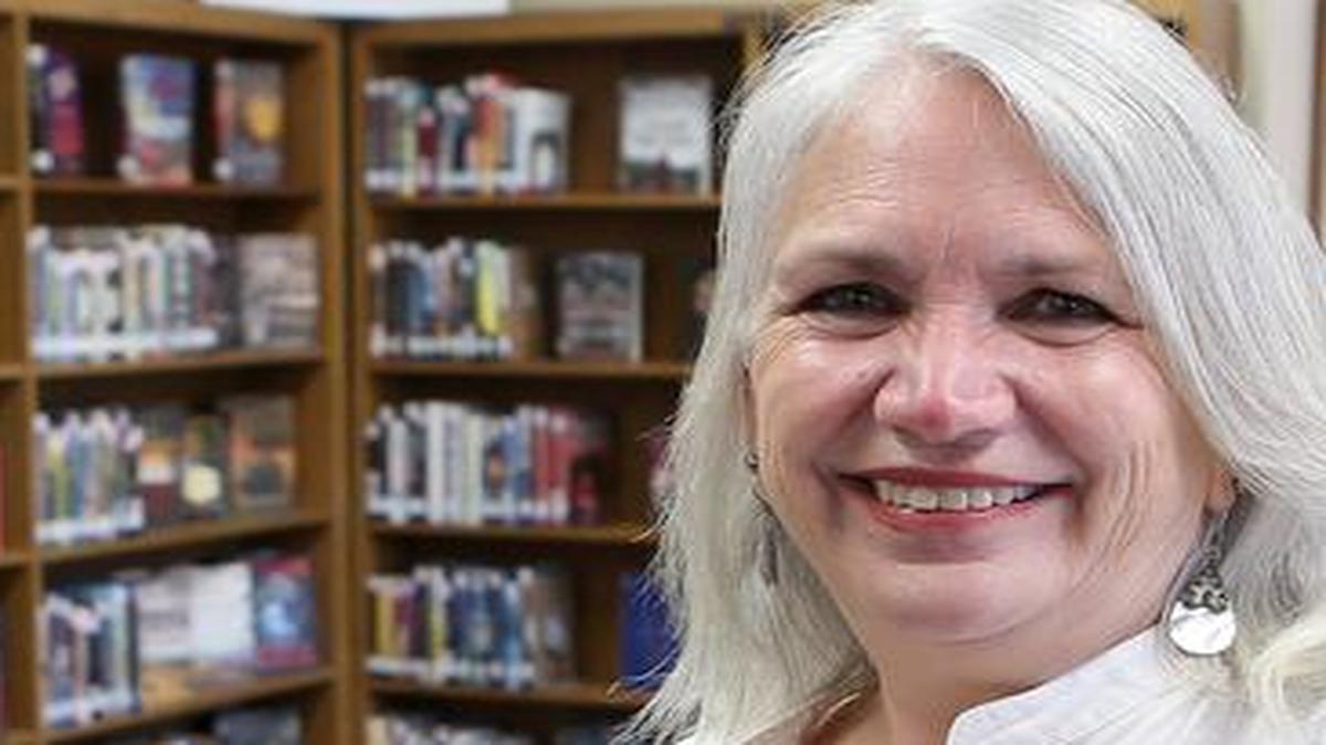 Vicky Hart and Barb Rhodes inside the Collinsville Memorial Library Center. Rhodes expanded library services to cover the local school district, an idea that other communities could develop through mergers.
