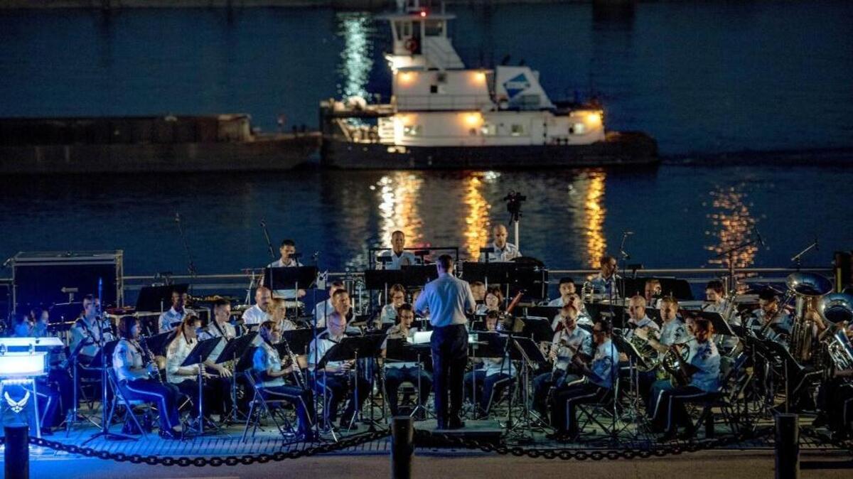 The U.S. Air Force Band of Mid-America plays next to the Mississippi River as a cargo ship floats by Sept. 30 in St. Louis. The band provided a concert at the St. Louis Gateway Arch in celebration of the Air Force’s 70th anniversary, which took place in September. The concert highlighted the importance of community and families in the success of today’s military.