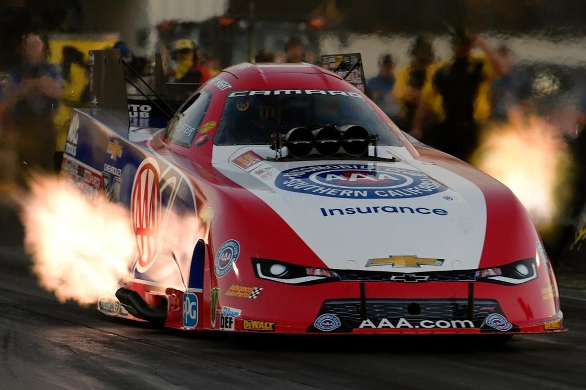 Flames erupt from the exhaust of the Robert Hight’s Chevrolet Camaro SS NHRA Funny Car during qualifying for the 6th annual AAA Insurance NHRA Midwest Nationals at Gateway Motorsports Park last season. The defending world champion is back in Madison this weekend.