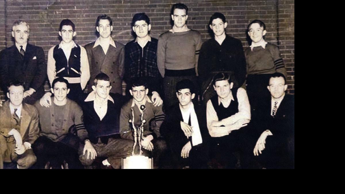 
The 1940 state championship basketball team from Granite City High School, top row from left: business manager Emil Mueller, John Markarian, Ed Hoff, Sam Mouradian, Everett Daniels, Ebbie Mueller and manager Harold Brown. Bottom row: Coach Byron Bozarth, Evon Parsaghian, Andy Phillip, Dan Eftimoff, Andy Hagopian, George Gages, and assistant coach Leonard Davis.

