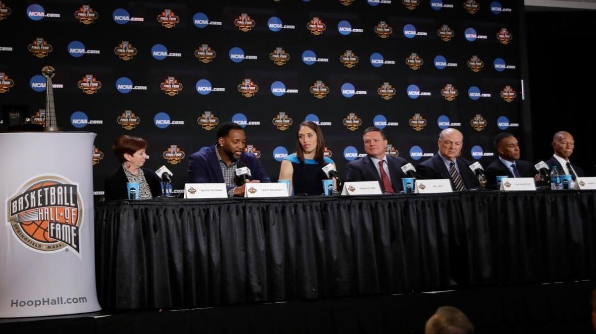 From left, Muffet McGraw, Tracy McGrady, Rebecca Lobo, Bill Self, Tom Jernstedt, Mannie Jackson and Robert Hughes answer questions at the Basketball Hall of Fame news conference, Saturday, April 1, 2017, in Glendale, Ariz.