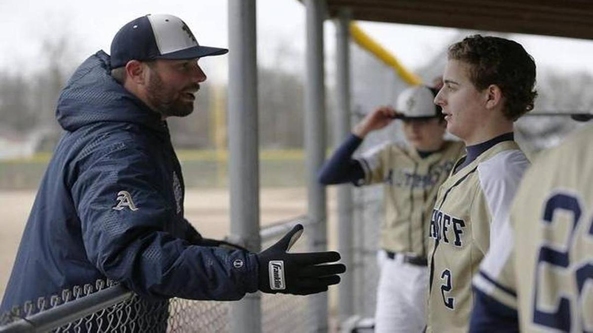 Former major league pitcher Randy Wells, left, is in his second season as the varsity baseball coach at Althoff High School. He resigned as pitching coach of the Gateway Grizzlies before his first season with the independent minor league team began.