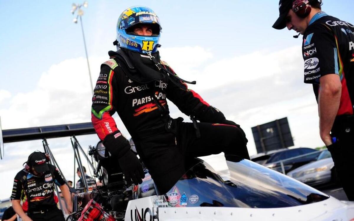 Clay Millican, NHRA Top Fuel Dragster, climbs into his car for qualifying for the 6th annual AAA Insurance NHRA Midwest Nationals at Gateway Motorsports Park in Madison Friday