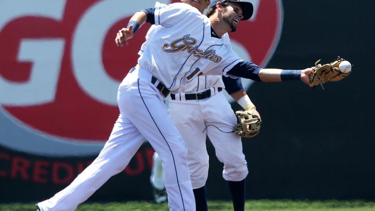 Gateway Grizzlies shortstop Logan Davis reaches and drops the ball on a infield popup Wednesday afternoon against the visting Southern Illinois Miners. See a gallery of photographs at bnd.com.